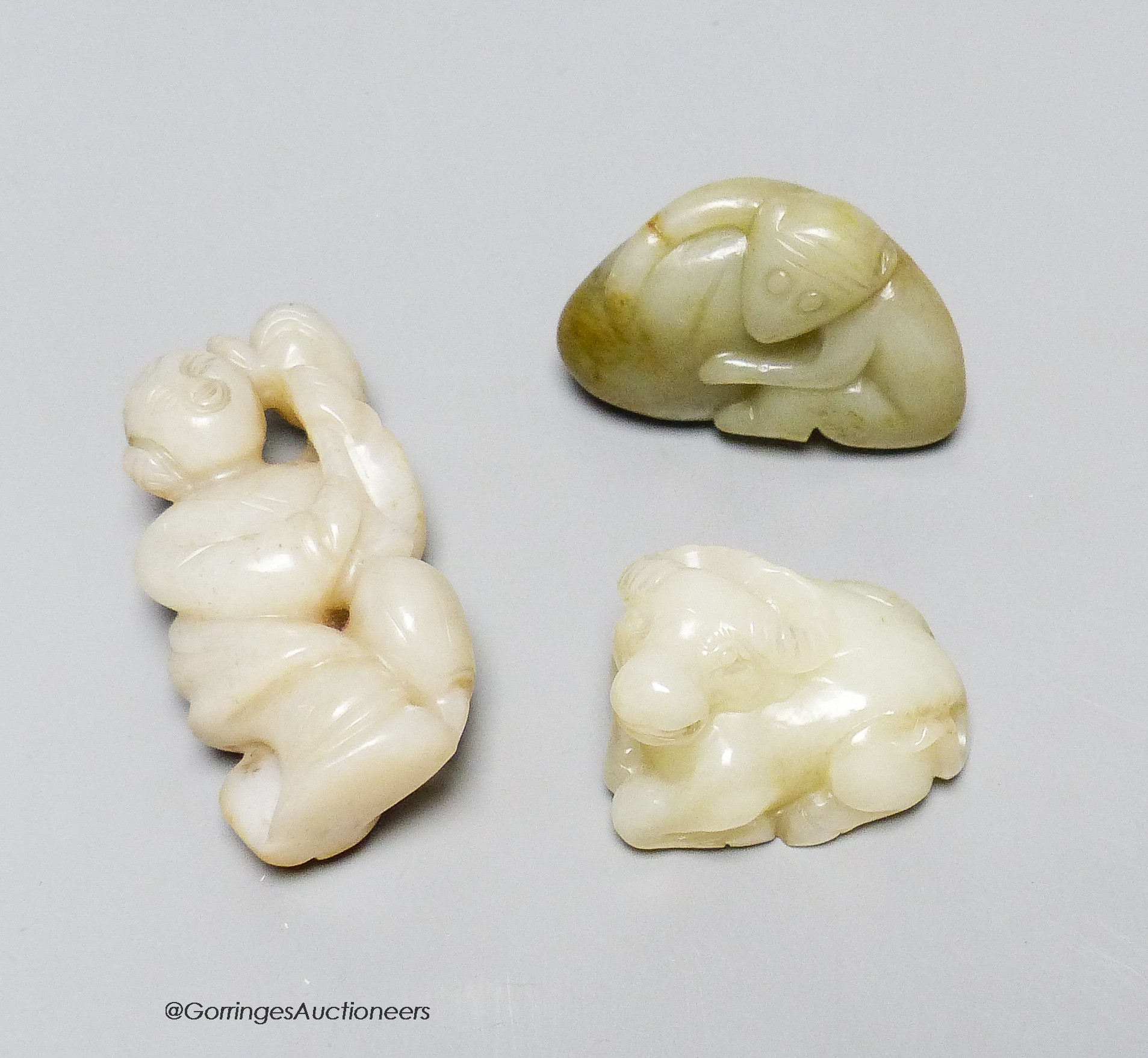 Three Chinese jade figures of a monkey, a buffalo and a lady, 4 - 7.2cm